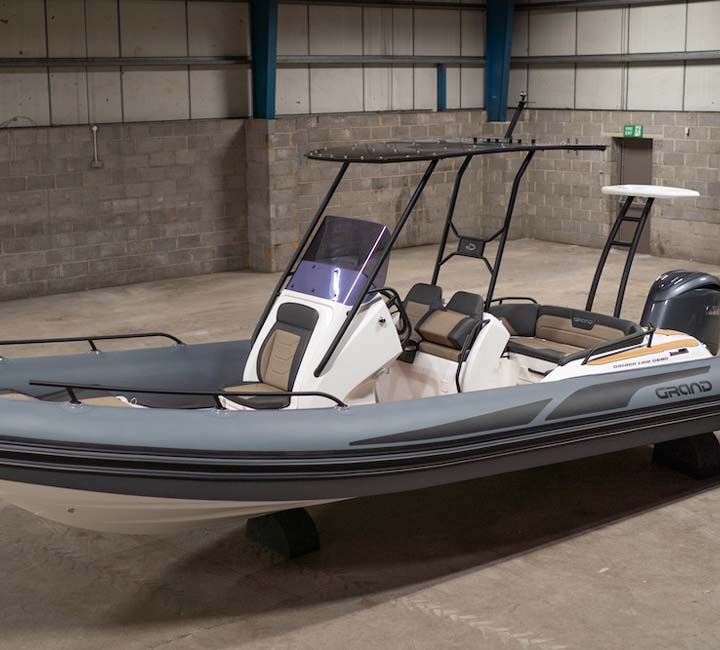 The new Grand G680 with its tee-top bimini, ski tower and grey tubes