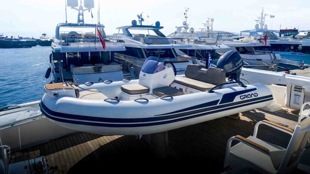 The Grand G380 with white tubes serving as a luxury yacht tender on the back of a super yacht