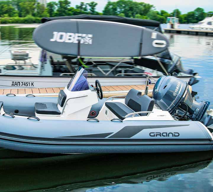 A Grand G420 in grey, moored on a pontoon