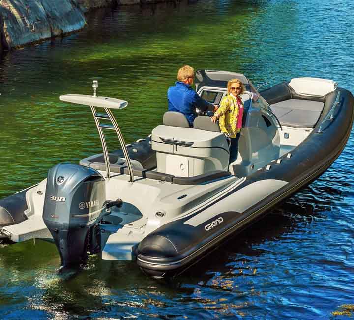 Two passengers travelling on a Grand G850 powered by a Yamaha 300HP engine