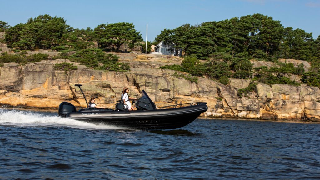 Rigid inflatable boats with black tubes and a family on the boat, a popular family boat