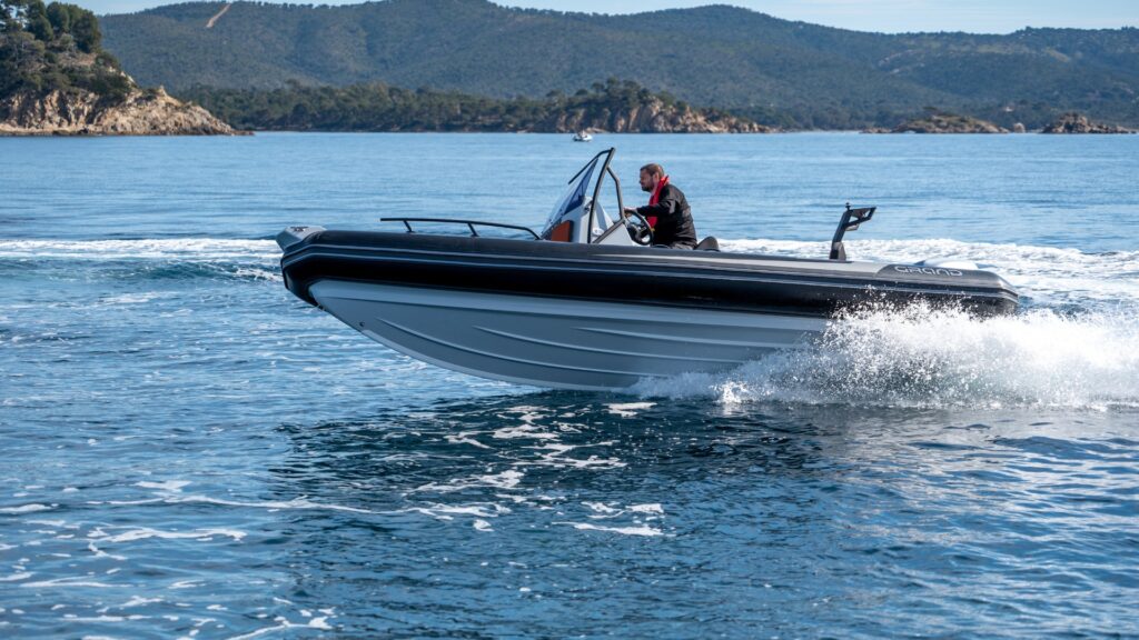 A bestselling trailer boat, the Grand D600 is a trailerable boat on the water with a driver on board