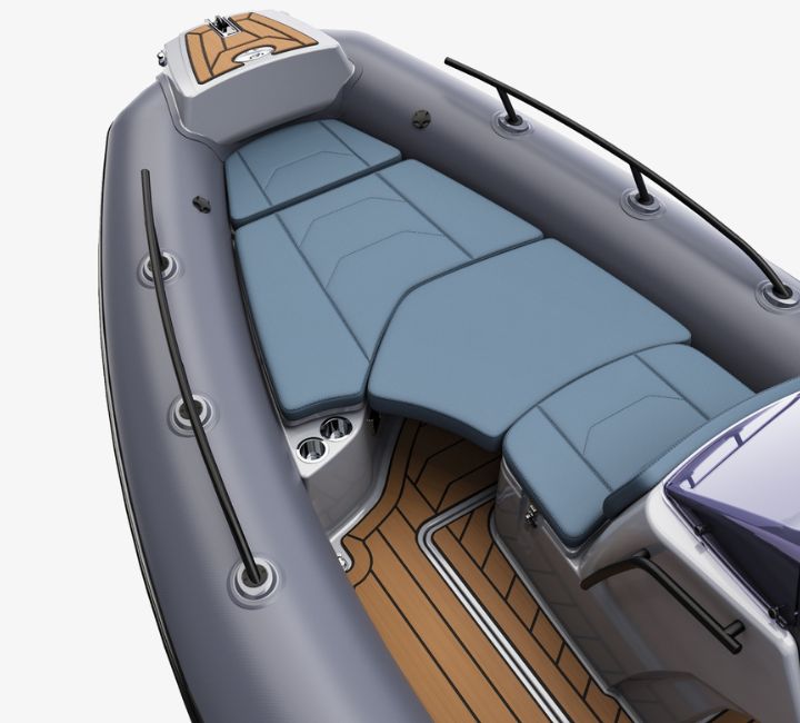 A render visual of the Grand G500 bow space, with blue seat cushions that have been extended to create a bed space