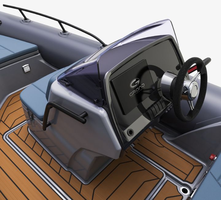 A render visual of the Grand G500's steering console with a dashboard chart plotter screen and steering wheel