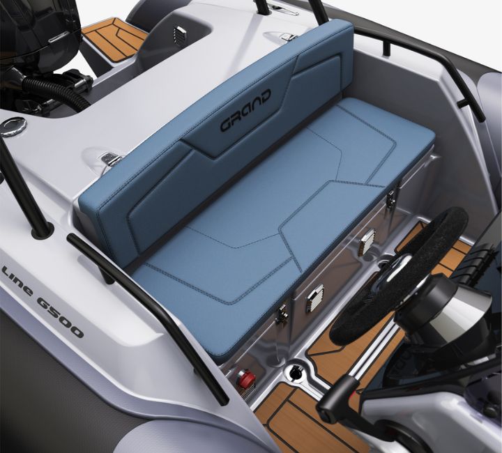 A render visual of the helm seating at the stern of the Grand G500, behind the steering wheel