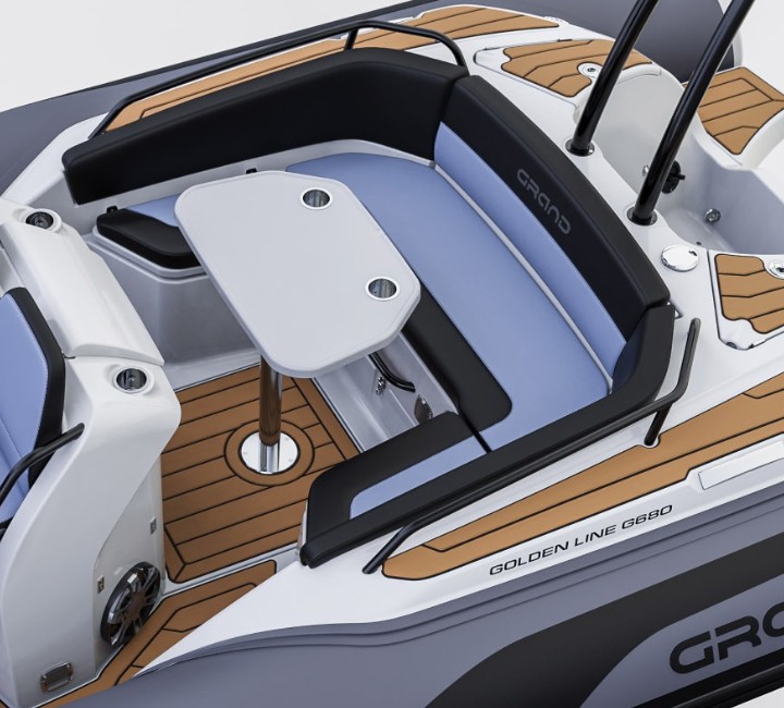 A render image of u-shaped seating and a table at the stern of the Grand G680 boat