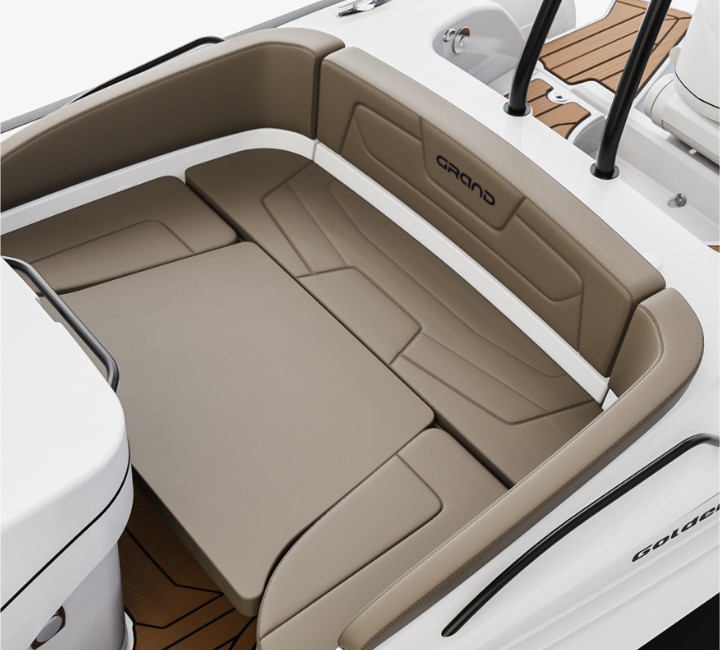 A render visual of the u-shaped seating at the stern of the Grand G850 with an extra cushion placed in the centre to make a large bed