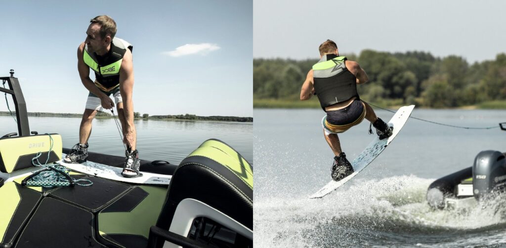 A man on a wakeboard getting ready behind a boat for wakeboarding