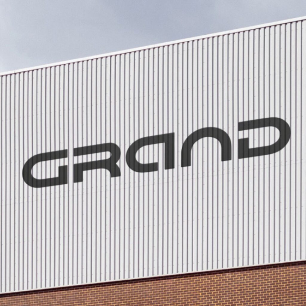 The Grand logo on the side of a building