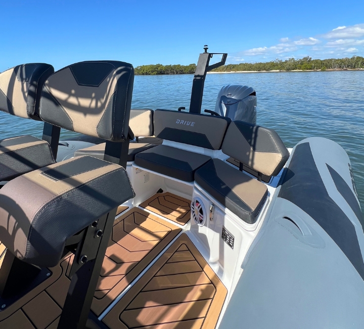 Two jockey seats and stern seating onboard a dark grey rigid inflatable boat