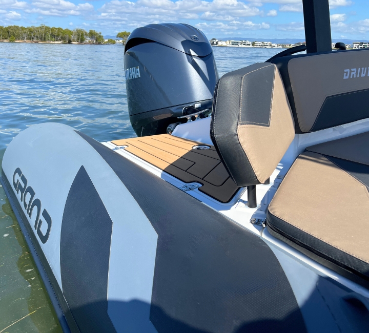 The stern of the Grand D600 with swimming platforms and a Yamaha engine