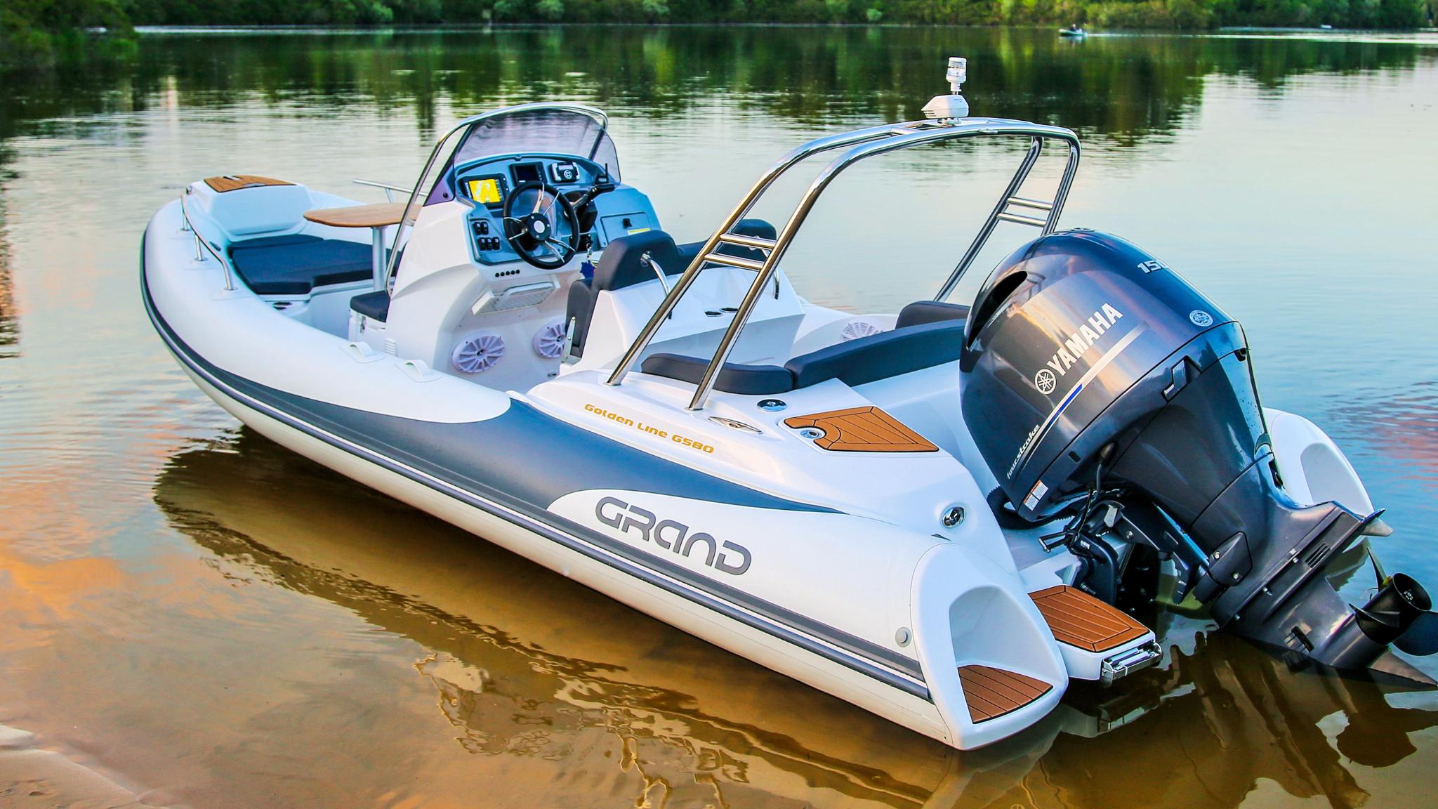 A Grand G580 boat sat on the water with a Yamaha Outboard