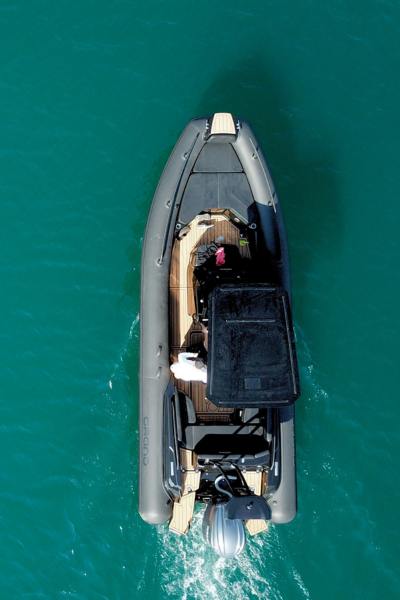 A Grand G750 rigid inflatable boat on the water with a black t-top