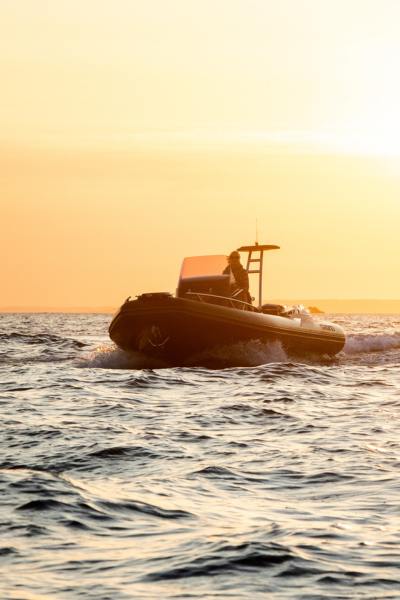 A Grand G750 boat at sunset on the water