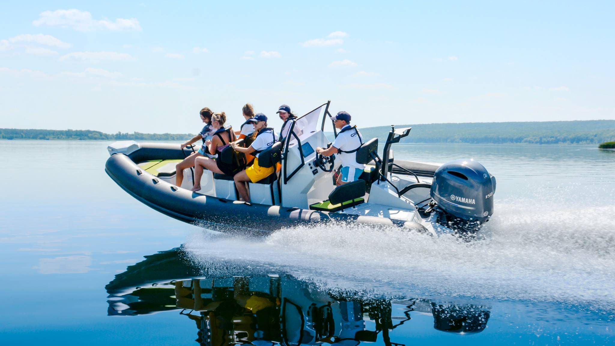 A Grand D600 rigid inflatable boat travelling through the water with 6 passengers on board