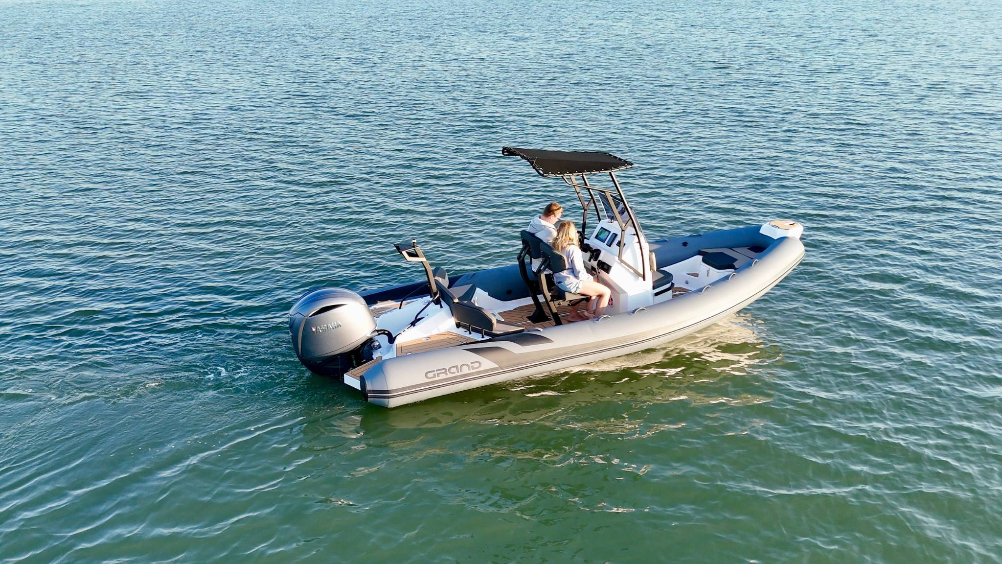 Two passengers onboard a Grand D600 boat