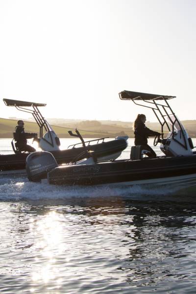 Two Grand D600 boats on the water in the sun