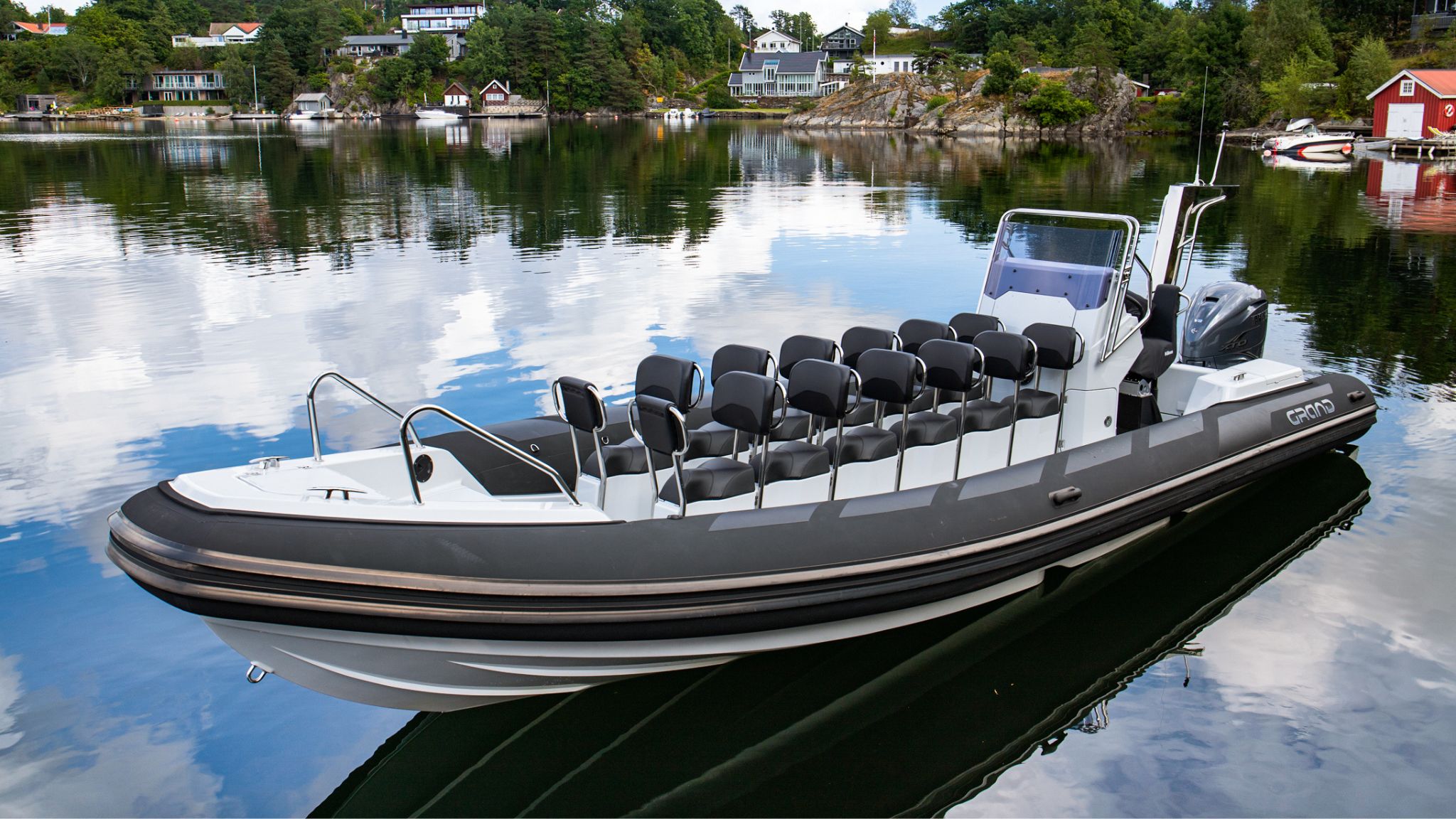 Grand D950 commercial rib boat with 14 seats sitting on calm waters