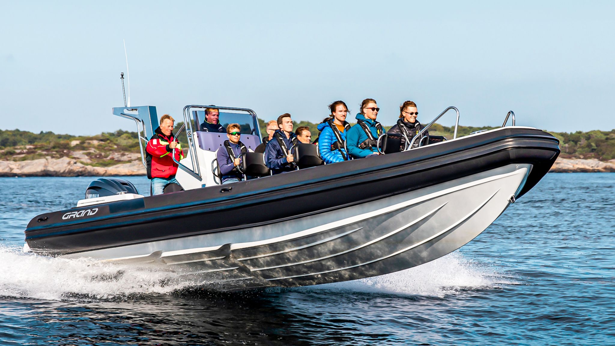 Grand D950 commercial RIB boat on the water with numerous passengers on board