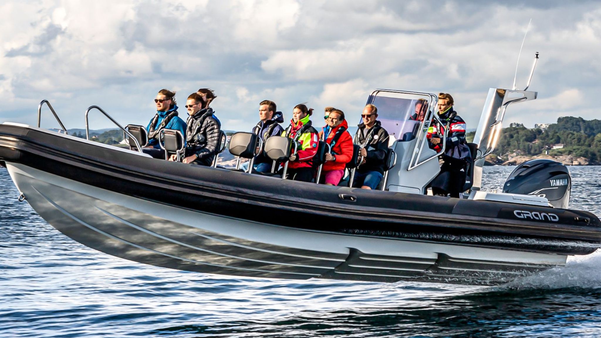 Grand D950 commercial RIB boat on the water with numerous passengers on board