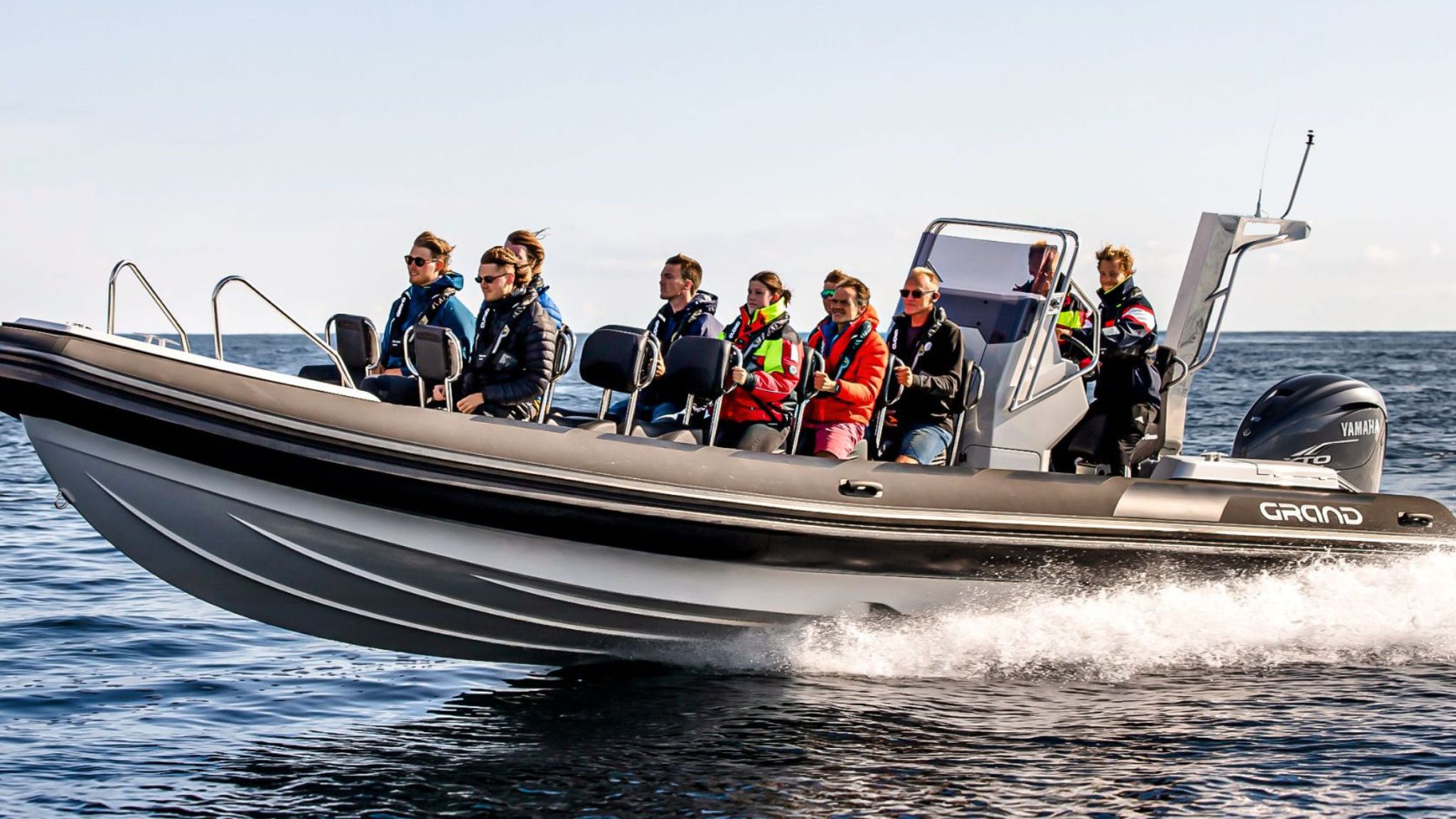 Grand D950 commercial RIB boat on the water with numerous passengers on board