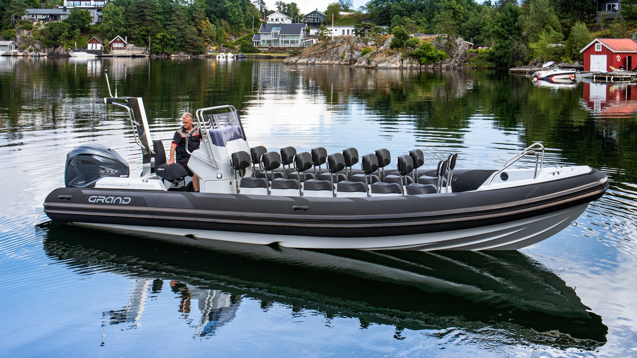 Grand D950 commercial rib boat with 14 seats sitting on calm waters