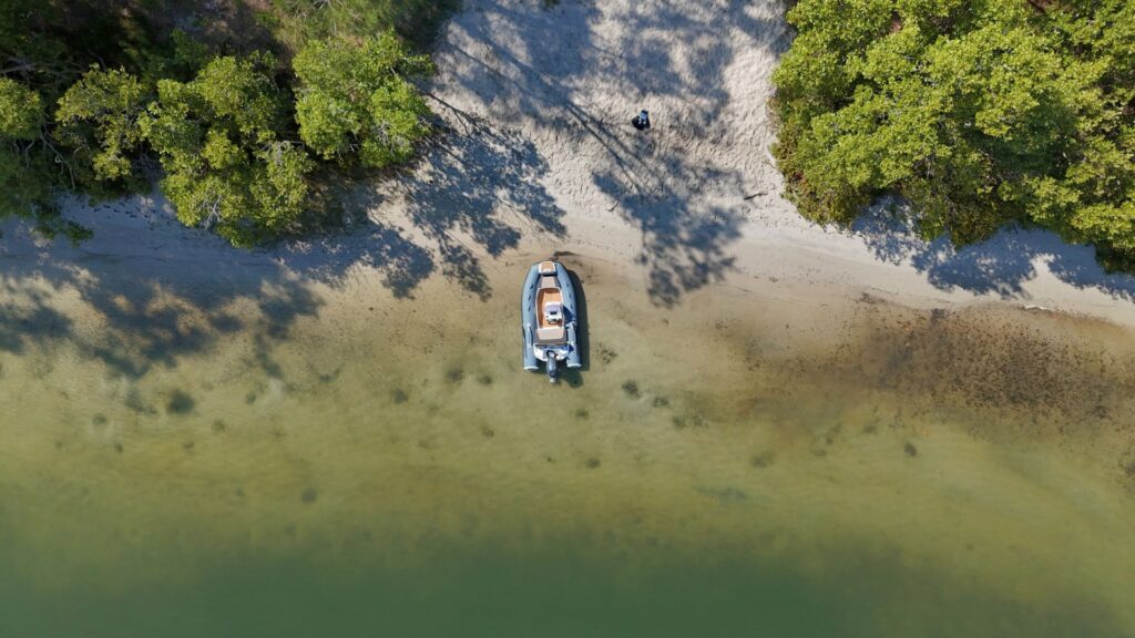 Grand G340 tender boat beached on the sand