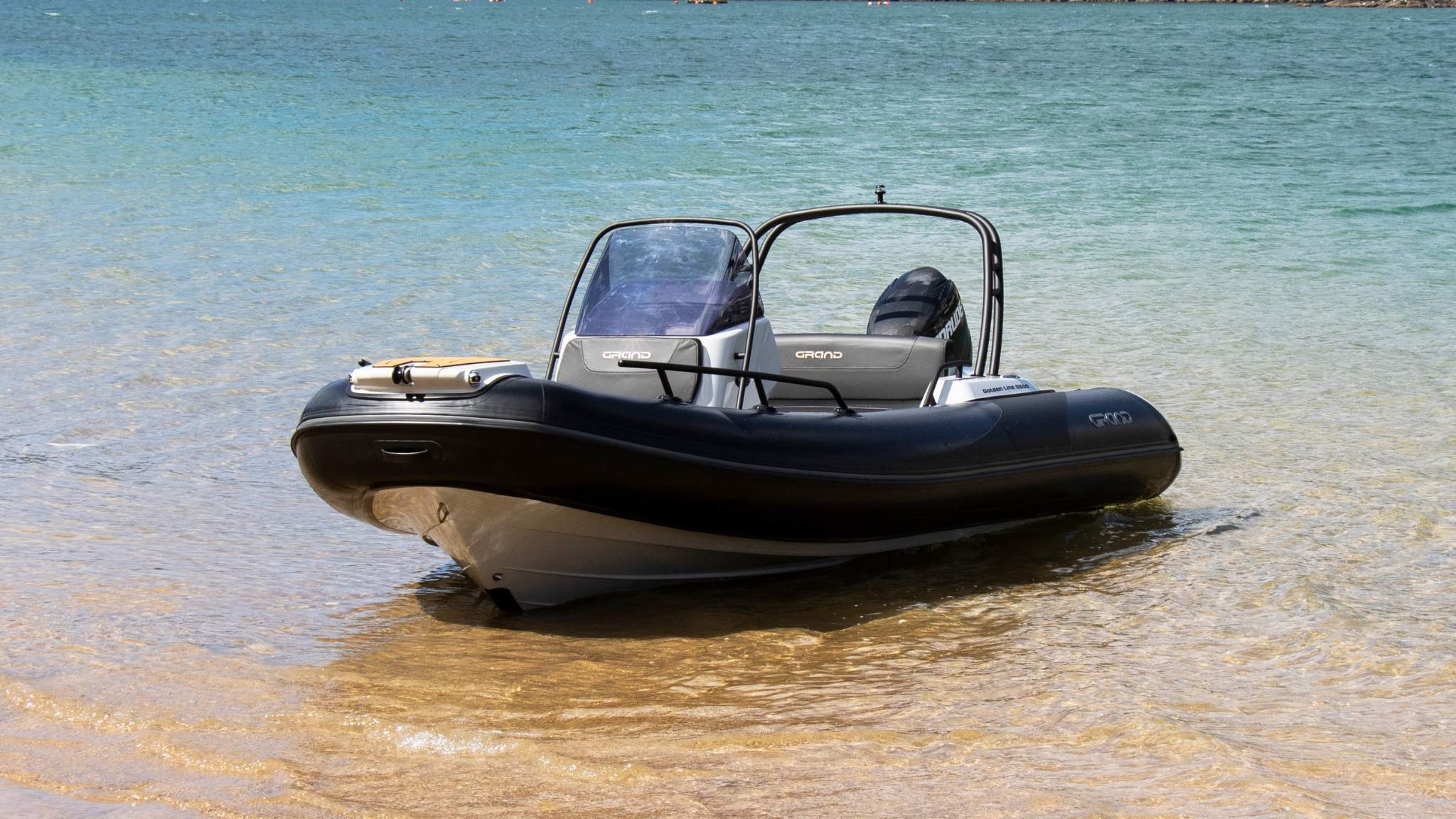 A Grand G500 boat sat on the sand