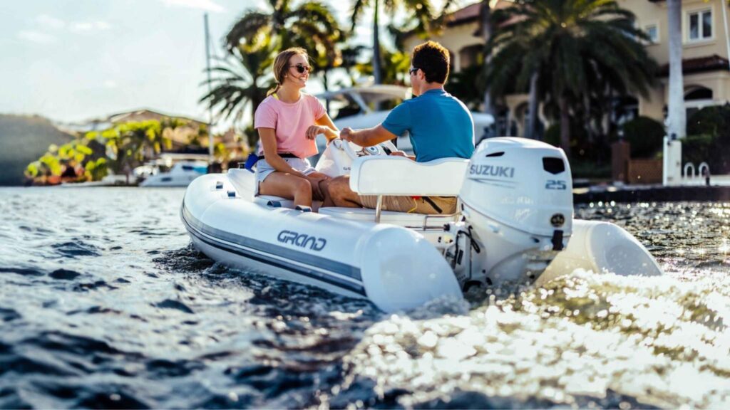 A Grand S300 on the water with two passengers