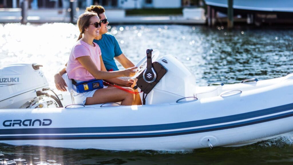 A Grand S300 on the water with two passengers