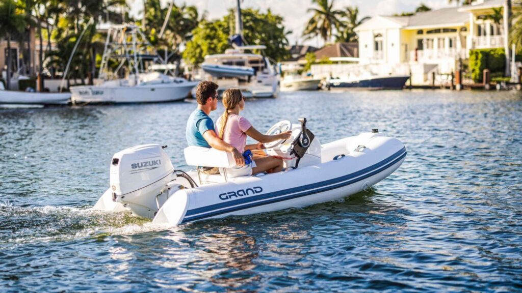 A Grand S300 on the water with two passengers