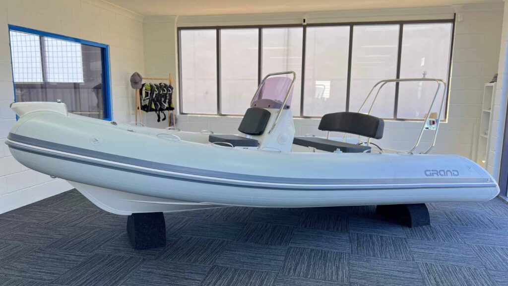 Light grey Grand S470 tender boat for sale with ski arch