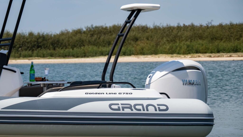 A close up a Grand rigid inflatable boat tube and Yamaha engine