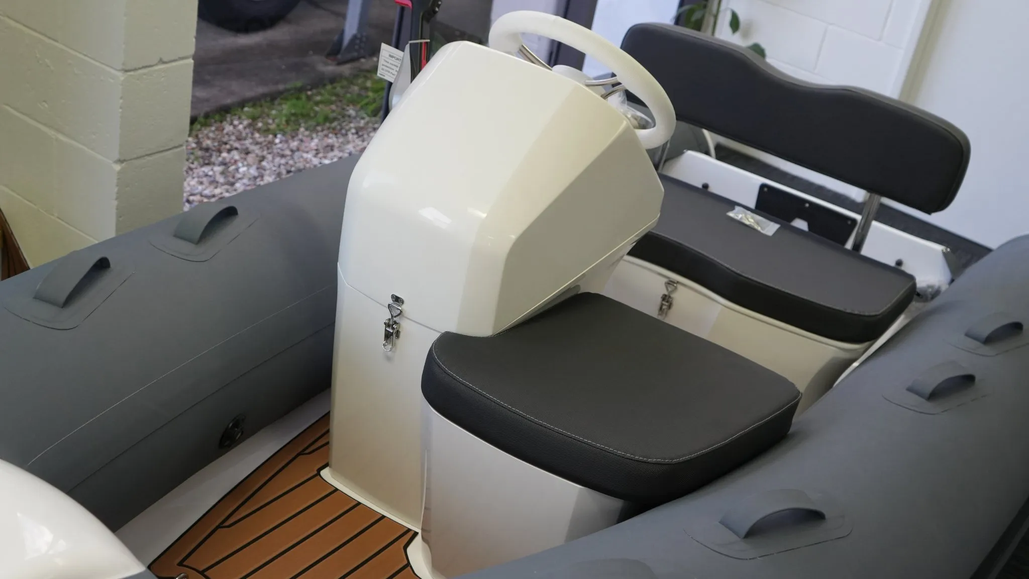 Grand S330 tender boat on display in a showroom