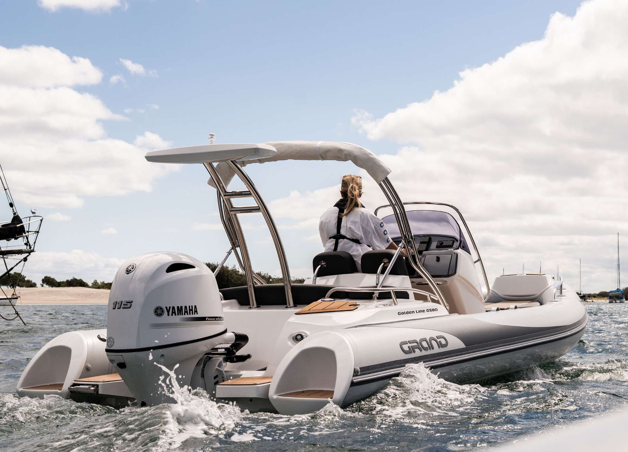 Woman driving a 5.8 metre rigid inflatable boat