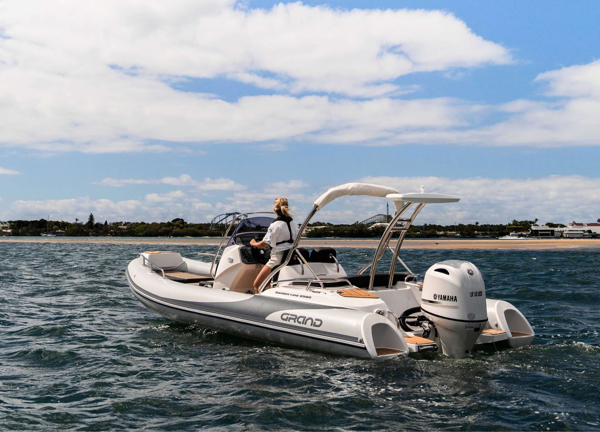 Woman driving a 5.8 metre rigid inflatable boat
