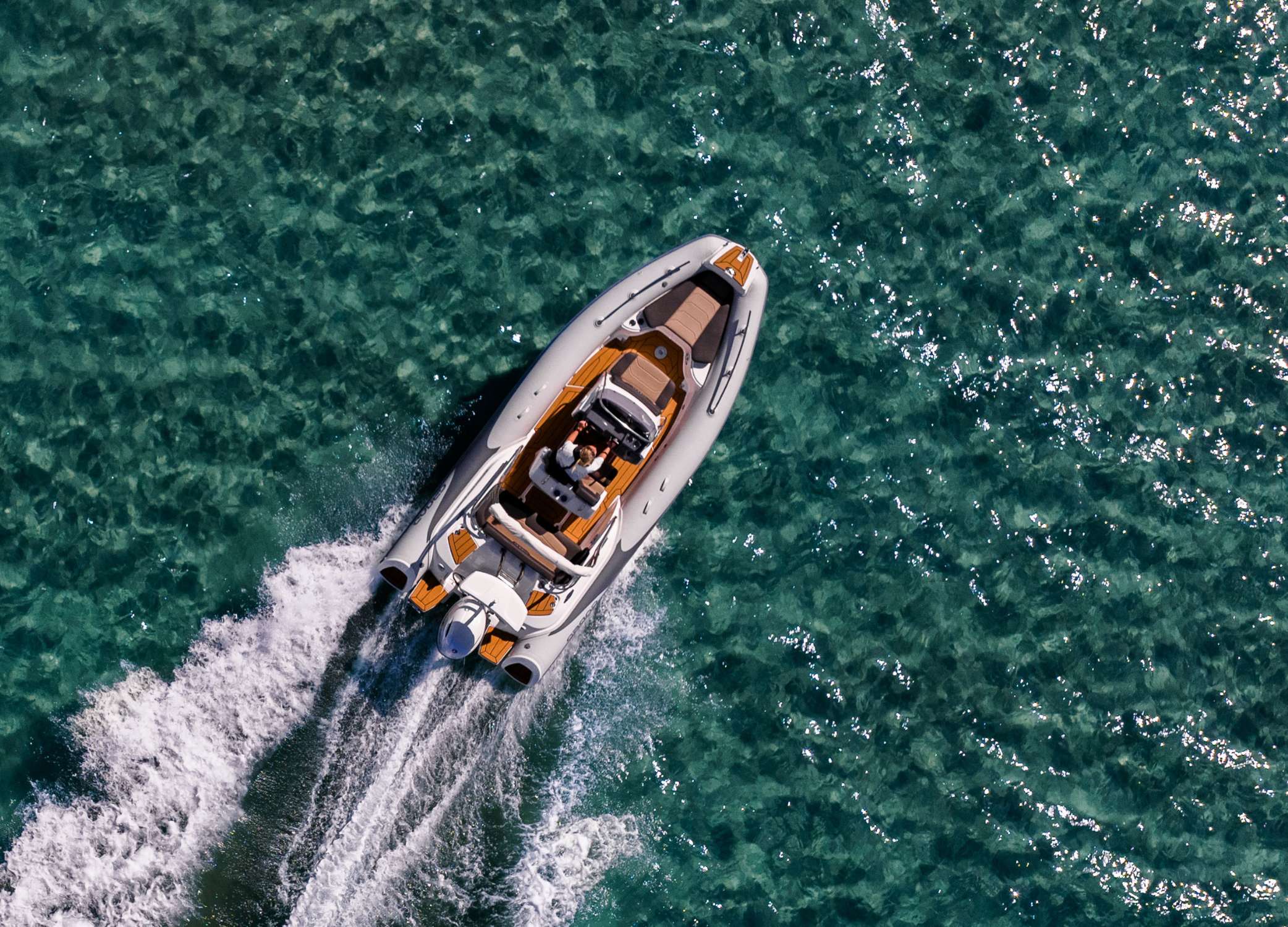 Grand G580 RIB boat driving on clear blue water