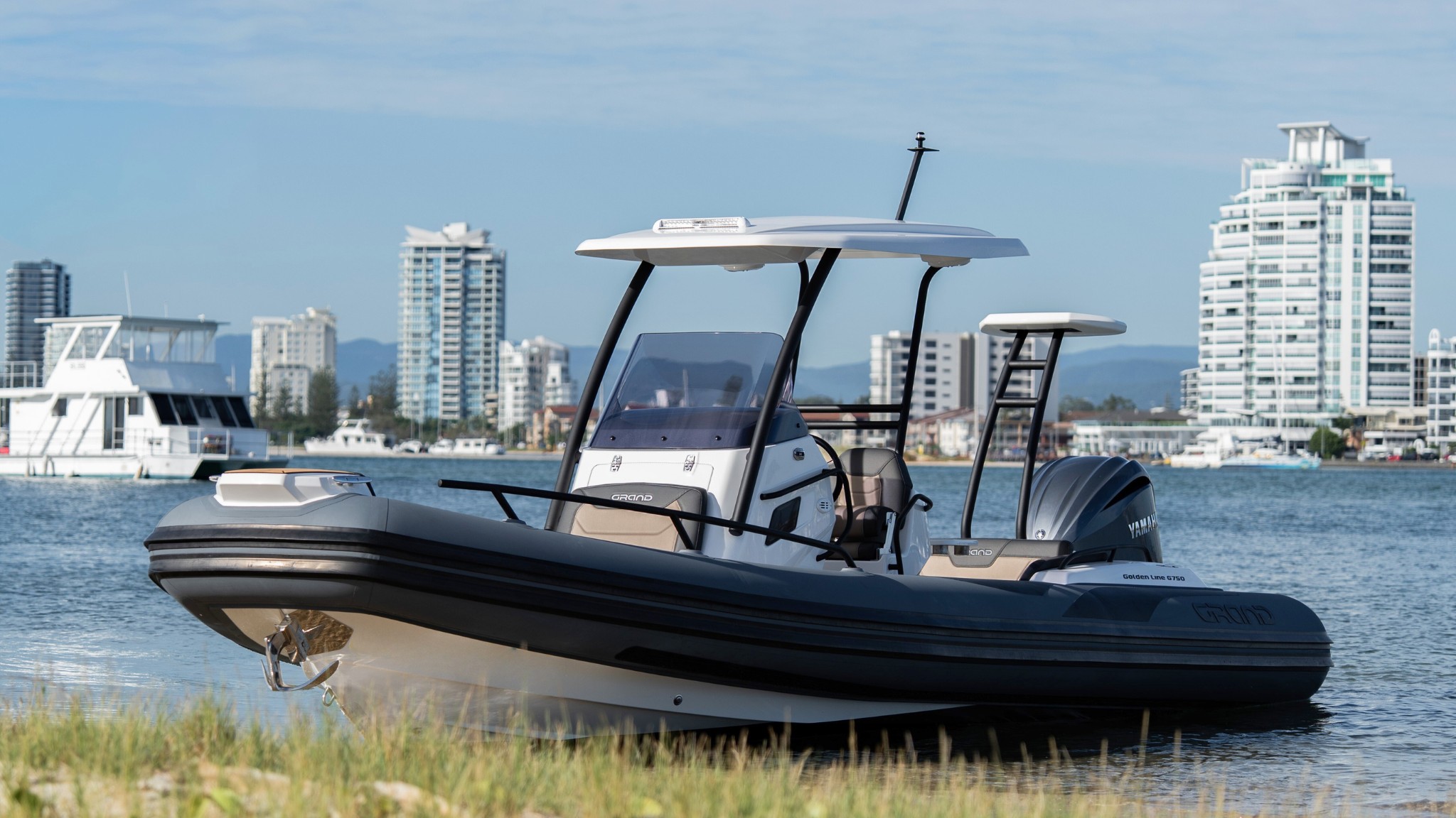 Grand G750 rigid inflatable boat beached on the sand