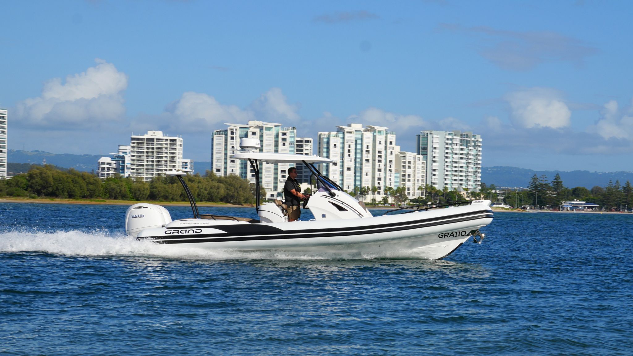 Grand G850 White rigid inflatable boat for sale driving on the Broadwater