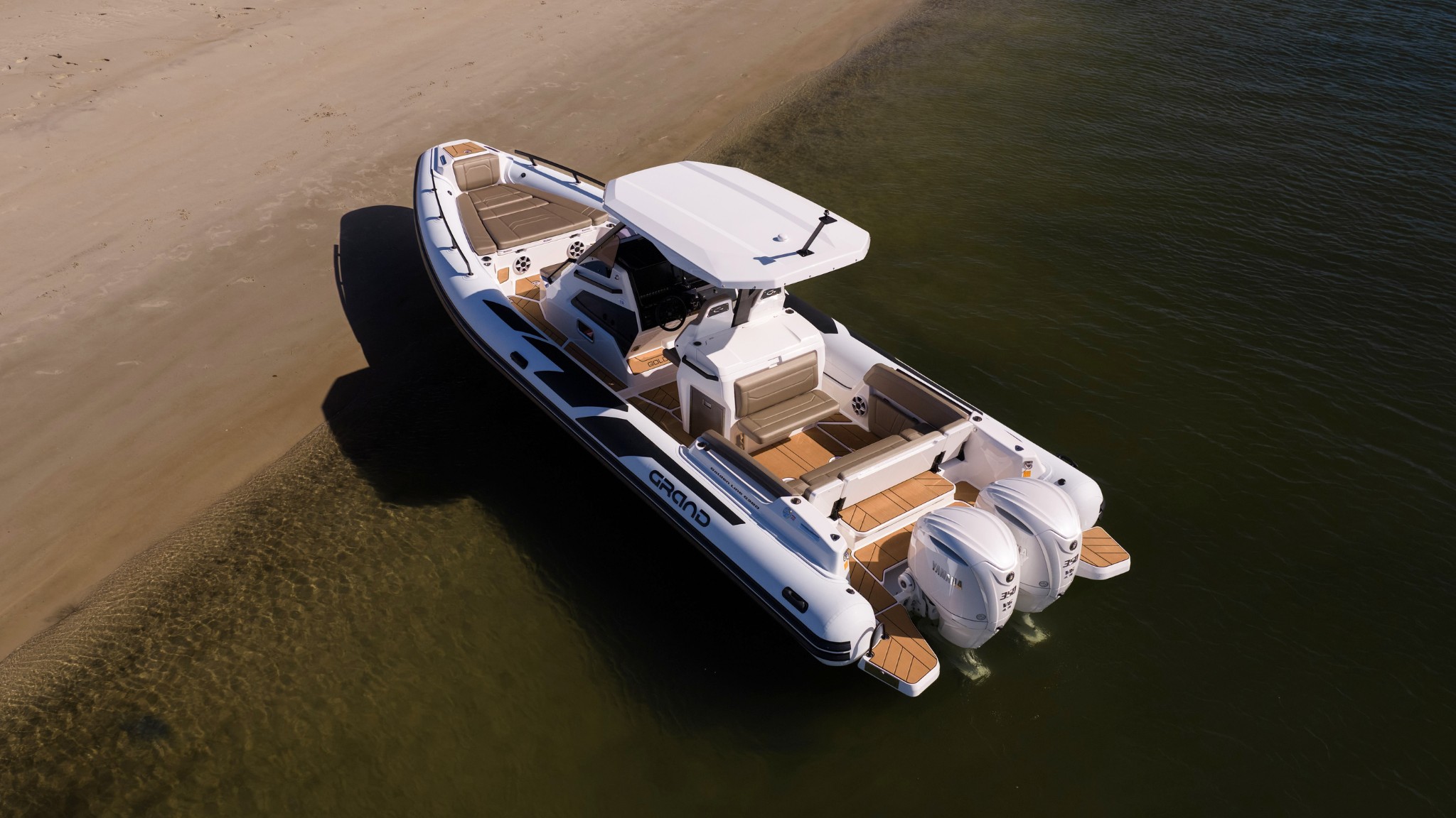 Grand G980 10 metre rigid inflatable boat on beach in Australia