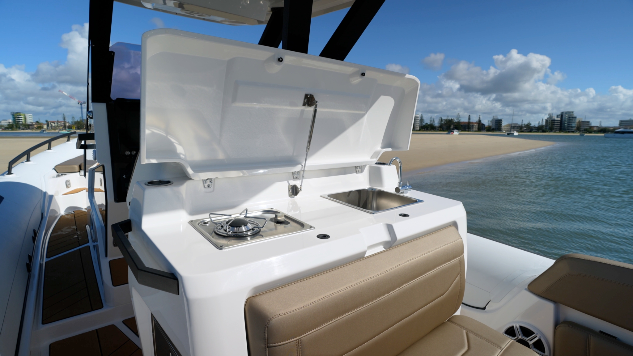Wet bar on the Grand G980 with a gas cooker, sink & tap and bar fridge