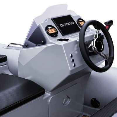 A close up render visual of the Grand G340's console, with steering wheel, dashboard screens and cupholders