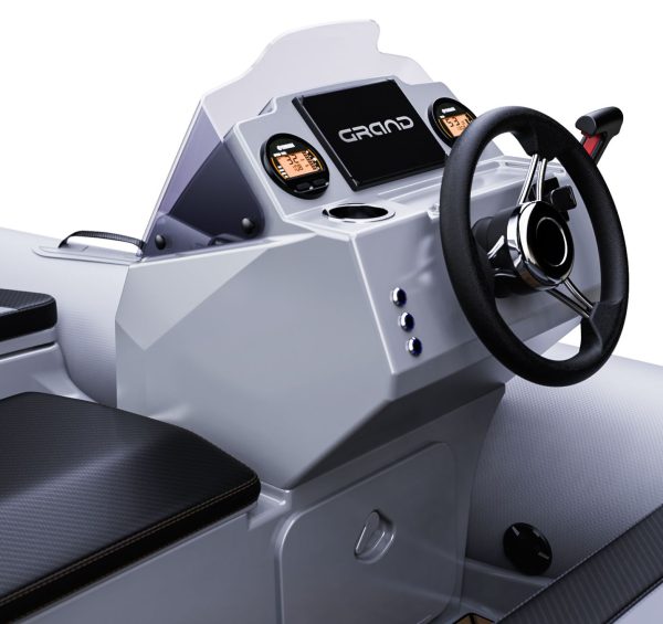 A close up render visual of the Grand G340's console, with steering wheel, dashboard screens and cupholders