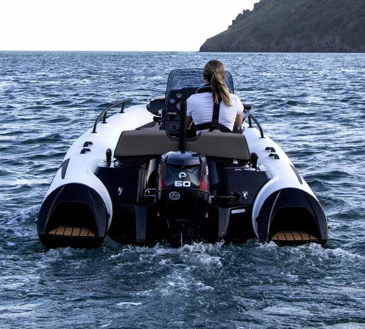 The Grand G420 in white from behind, showing the seadeck step ends at the stern