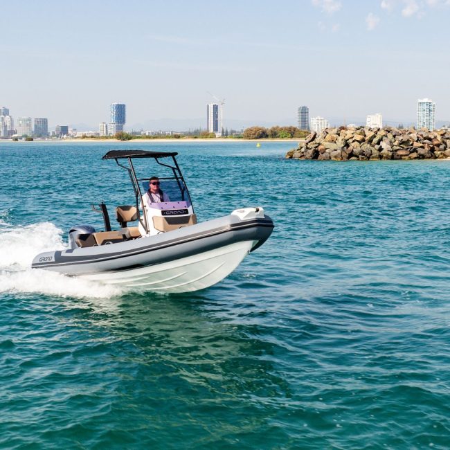 A 6 metre rigid inflatable boat travelling through the water