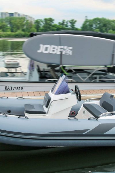 A Grand G420 boat sat on the water near a pontoon