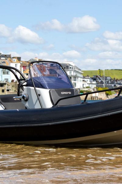 A Grand G500 boat sat on the sand in a harbour