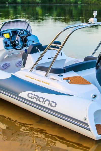 A Grand G580 boat sat on the water with a Yamaha Outboard