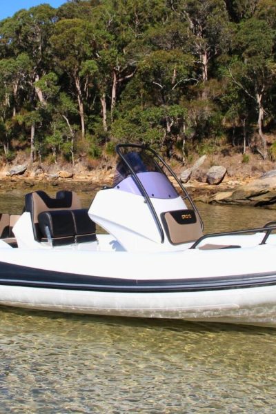 A white Grand G580 boat sat on the water