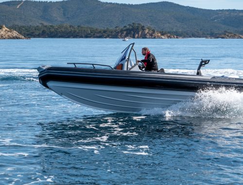 A bestselling trailer boat, the Grand D600 is a trailerable boat on the water with a driver on board